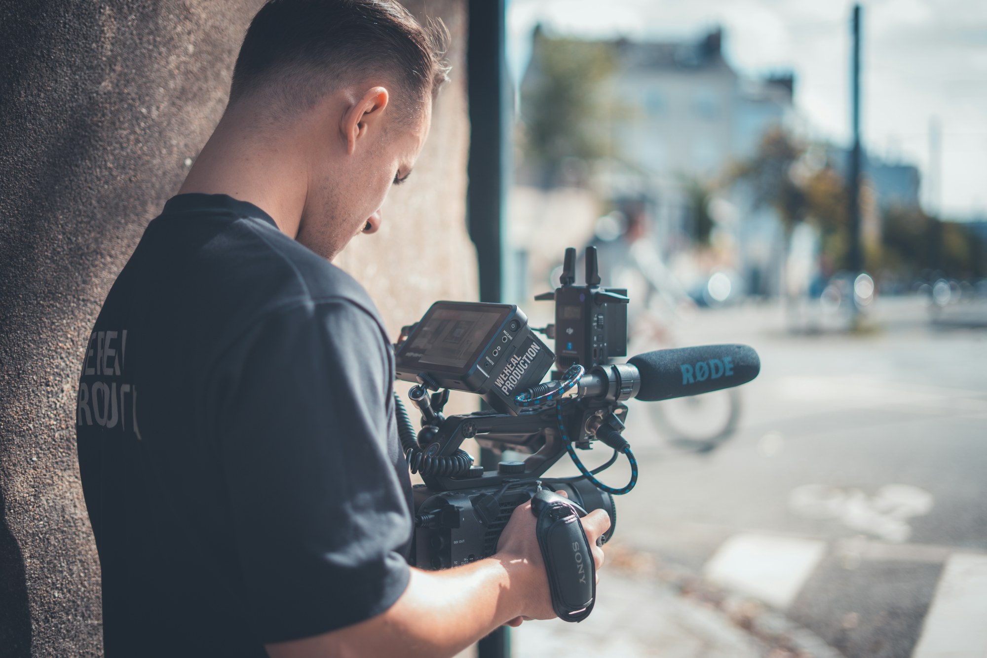 A documentary camera operator preparing to film